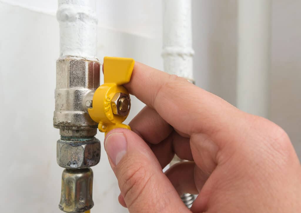 yellow gas valve on gas pipe